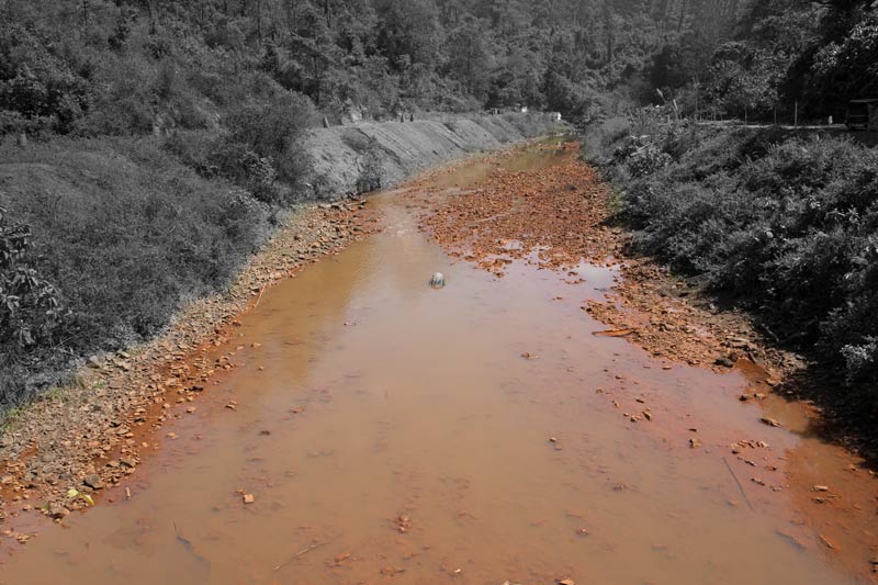 Tipong river polluted by acid mine drainage near Tipong Colliery of Makum Coalfield in Tinsukhia district, Assam